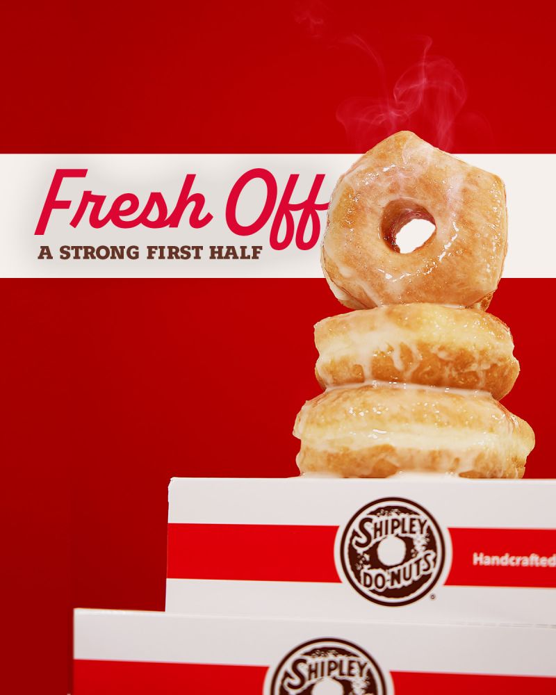 Shipley Do-Nuts graphic featuring a stack of glazed donuts on branded boxes with the text “Fresh Off a Strong First Half.”